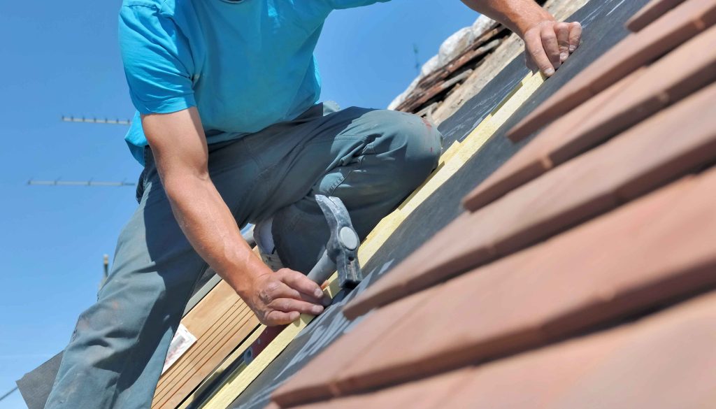 A Petaling Jaya homeowner relaxes under a sparkling clean gutter system, letting the rain fall without a worry.