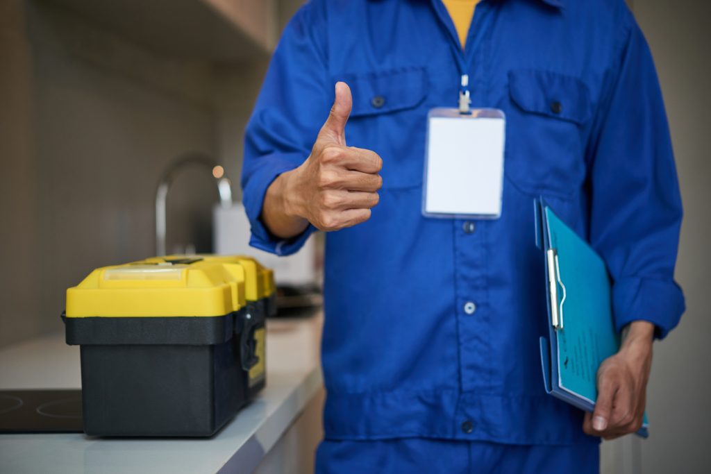 Plumber fixing a kitchen sink in Petaling Jaya